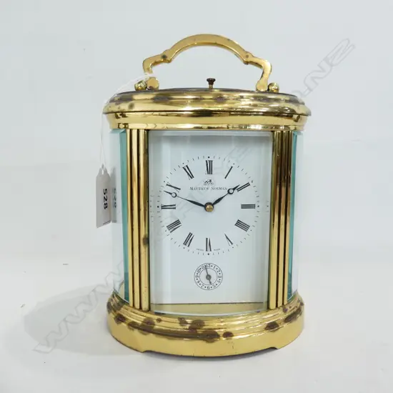 LG BRASS CARRIAGE CLOCK IN GLASS CSE BY MATTHEW NORMAN, MADE IN SWITZERLAND H. 190mm