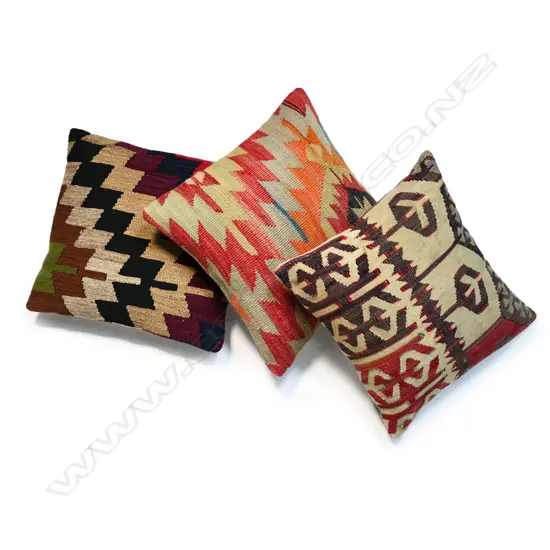 Three scatter cushions with various old kilim faces,