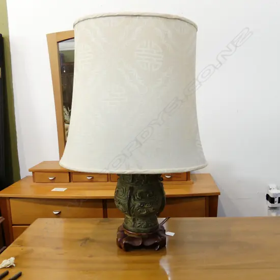 ORIENTAL LAMP H.760mm; HEAVY BRONZE ARCHAIC STYLE BASE ON CARVED WOODEN PLINTH