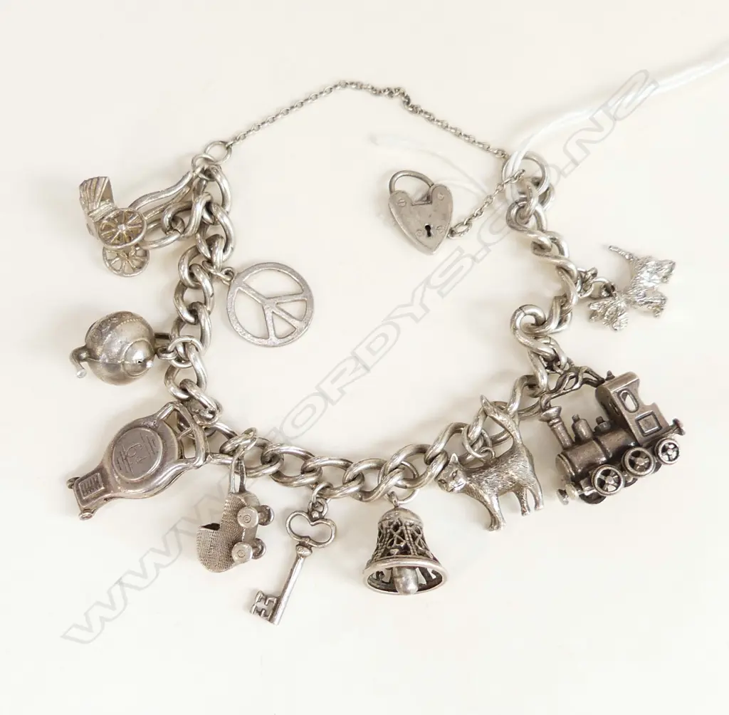 STG SILVER CHARM BRACELET 56 GRAMS Image 1++