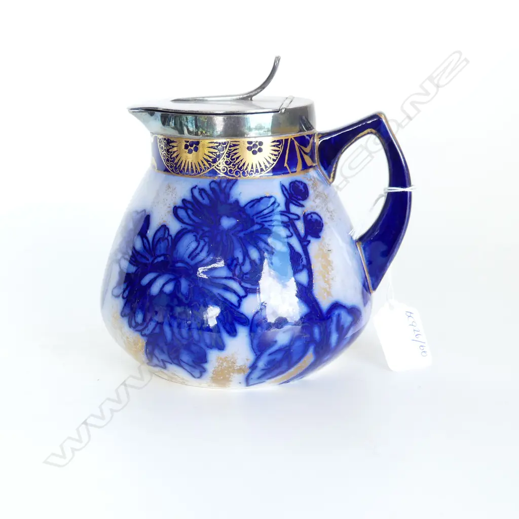 An Edwardian Royal Doulton jug with silver plate cover Image 1++