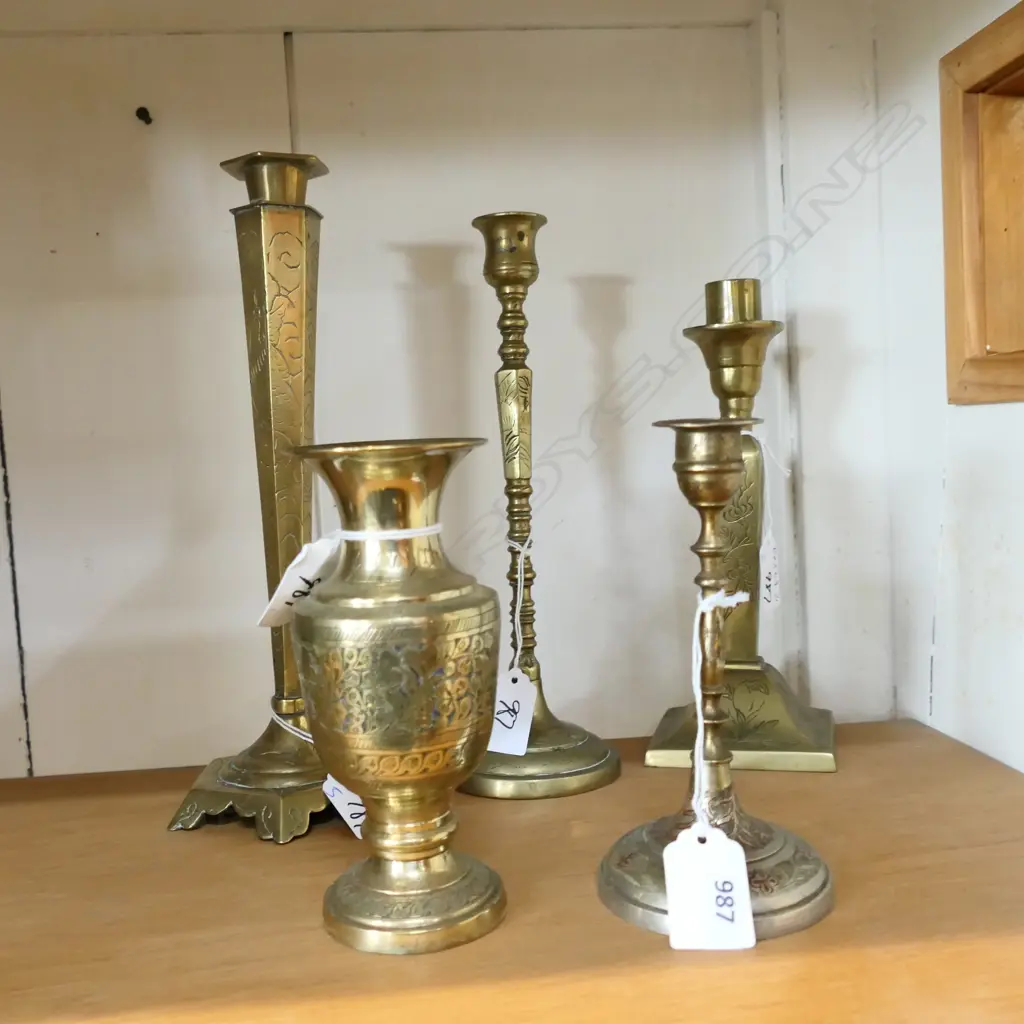 FIVE 'INDIAN STYLE ' BRASS CANDLESTICKS WITH ENGRAVED DETAIL. TALLEST 270 SHORTEST 150mm Image 1++