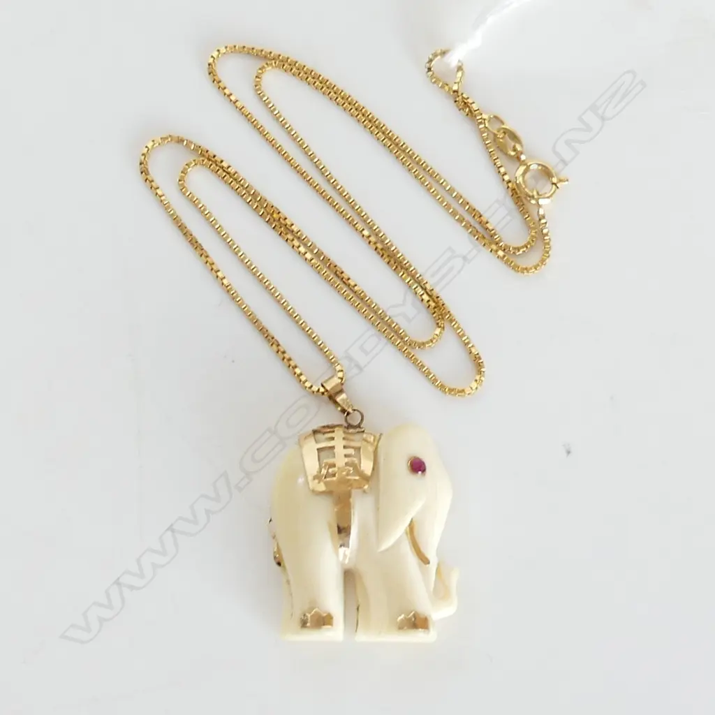 IVORY ELEPHANT PENDANT, RUBY EYE & 14CT HIGHLIGHTS (2.5mm) ON G/PLATE CHAIN Image 1++