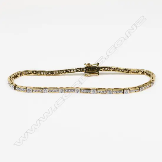 9CT YELLOW GOLD & CUBIC ZIRCONIA TENNIS BRACELET 8.78gms ONE STONE MISSING