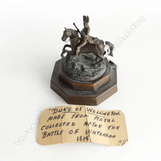 SMALL BRONZE STATUE OF WELLINGTON WITH ' DUKE OF WELLINGTON MADE FROM METAL COLLECTED AFTER THE BATTLE OF WATERLOO 1815'
