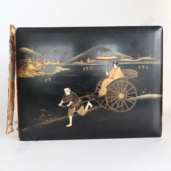 A late 19thC Japanese large photo album the black lacquered cover with a coastal scene including rickshaw insects and florals