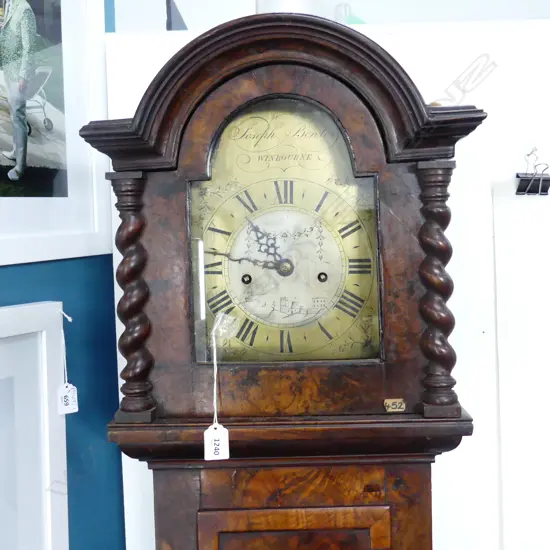 MID 18THC FIGURED WALNUT LONCASE CLOCK BY JOSEPH BOWLES OF WINBOURNE. BRASS DIAL . BARLEY TWIST HOOD SUPPORTS. H. 1900mm