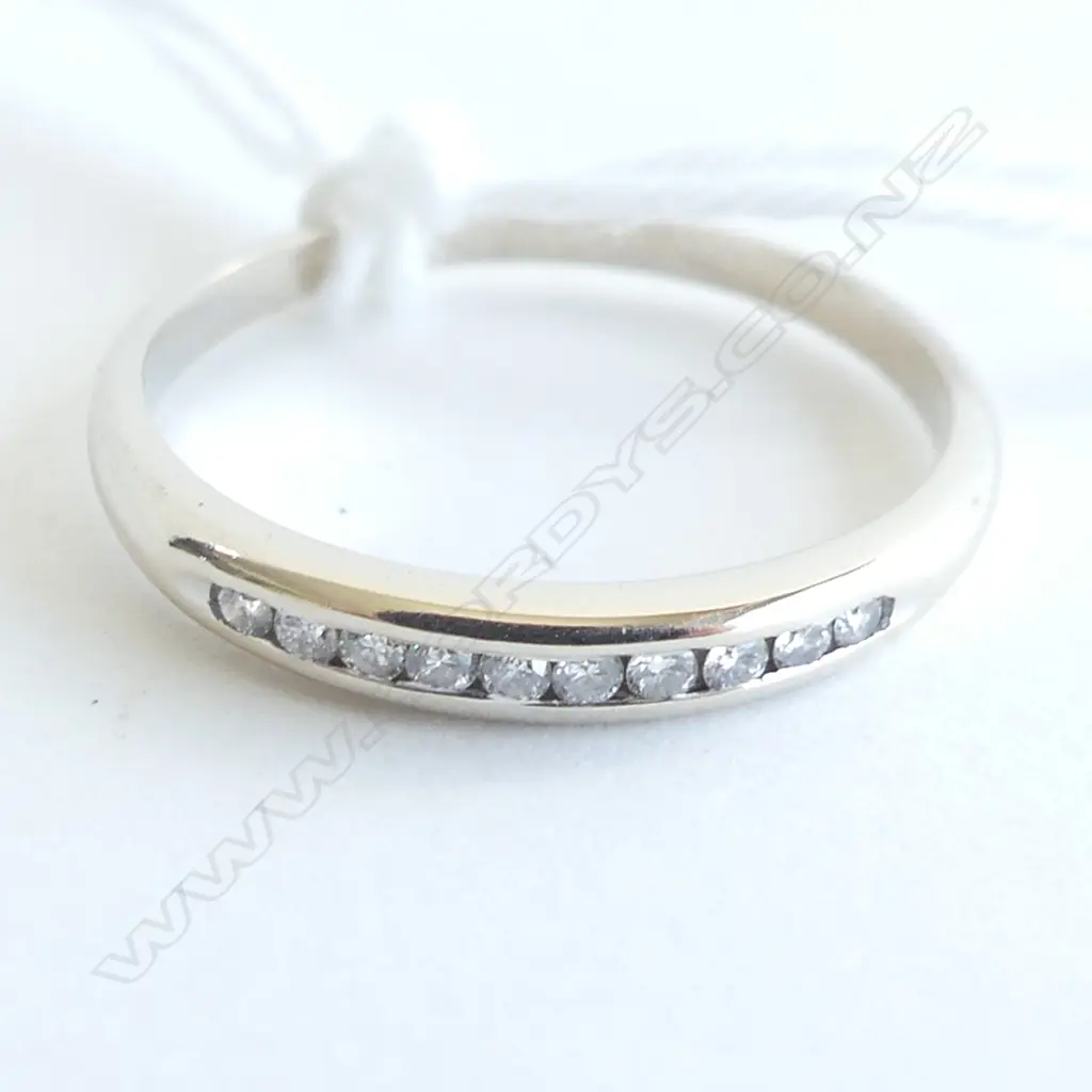 18CT WHITE GOLD & DIAMOND CHANNEL SET RING 1.6GMS Image 1++