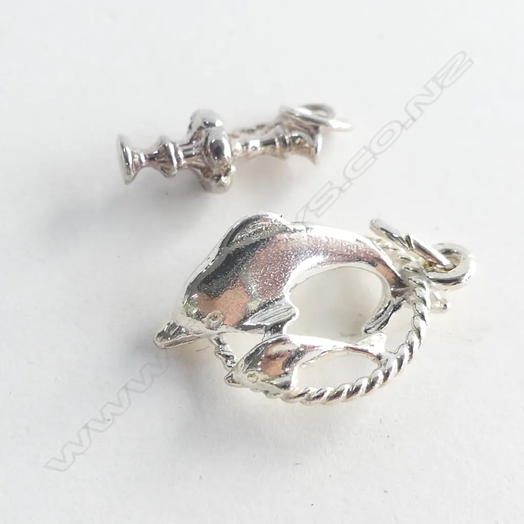 TWO STG SILVER CHARMS; AMERICA'S CUP TROPHY (?) & DOLPHIN WITH HOOP 3.17GMS  Image 1++