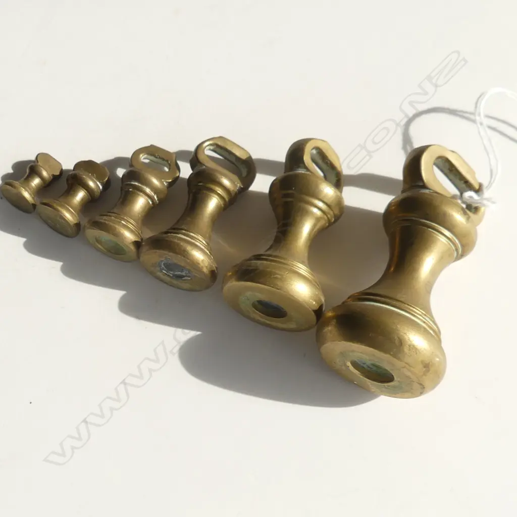 ANTIQUE SET 6 GRADUATED SMALL DUMBELL WEIGHTS  the lgest = 8oz. In tin w elephant lid Image 1++