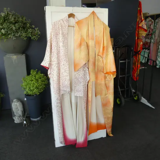 2 SILK KIMONOS, 1 CREAM WITH RED BUTTERFLIES & 1 PEACH COLOURED