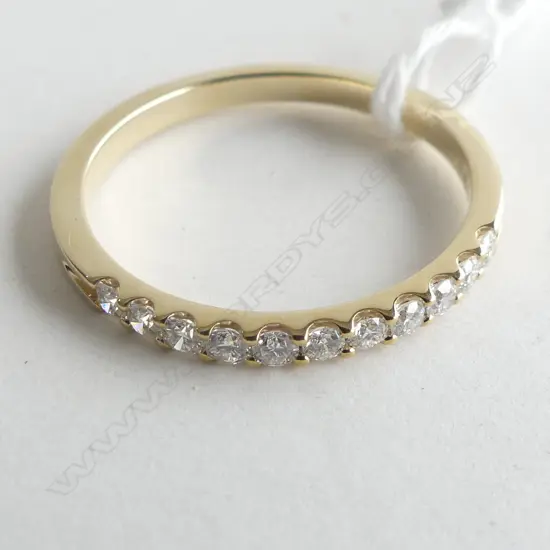 9CT YELLOW GOLD CLAW SET BAND 0.33CT  2.0GMS (WITH VALUATION)