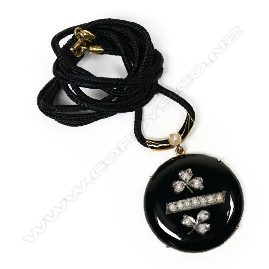 A 9ct gold and silver watch back pendant,