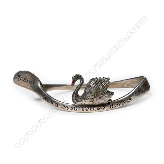 A silver napkin ring and place name holder,