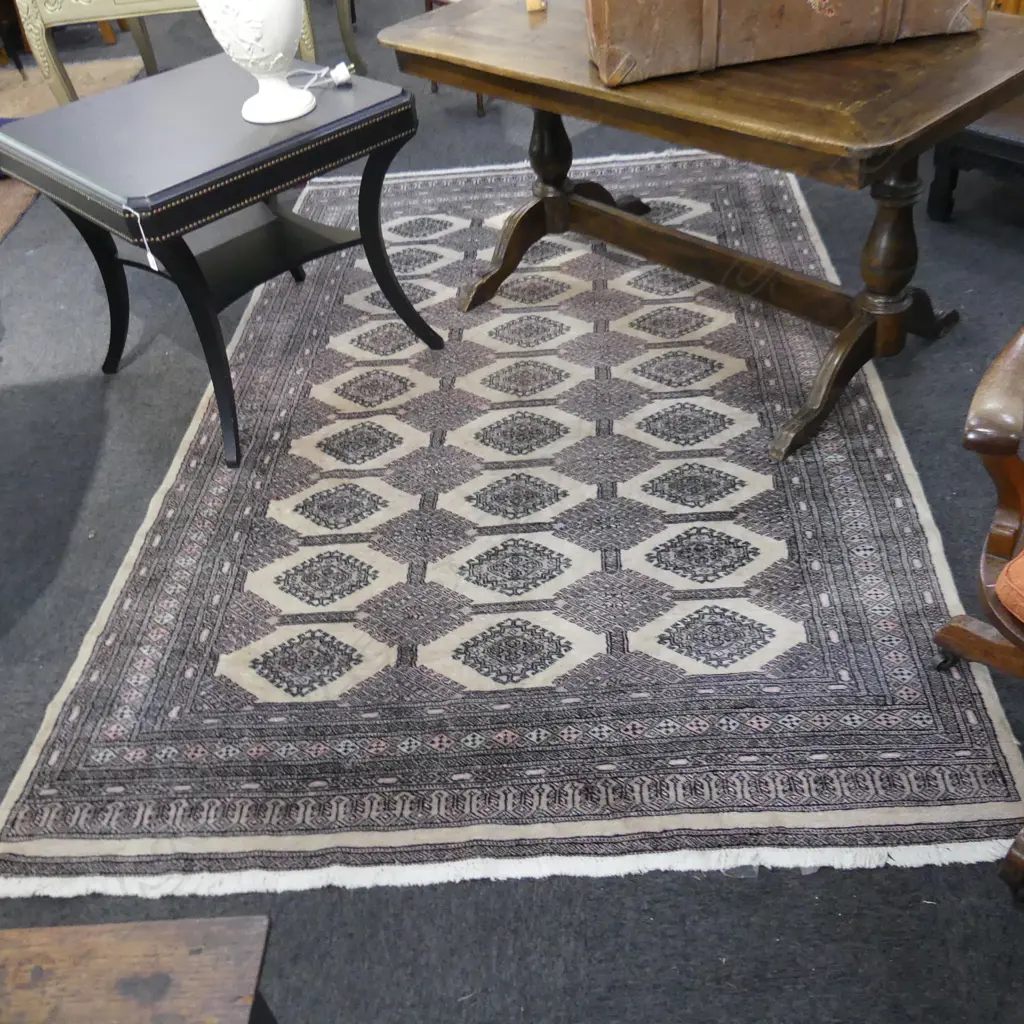 PAKISTANI BOKHARA HANDKNOTTED WOOL PILE RUG; many medallions on pale tan ground 2750x1730mm Image 1++
