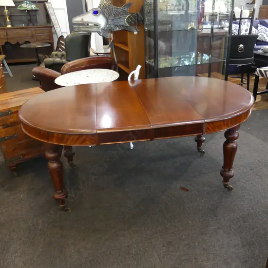 VICTORIAN MAHOGANY EXTENSION DINING TABLE ON CASTORS (DIA 1060MM UNEXTENDED)...
