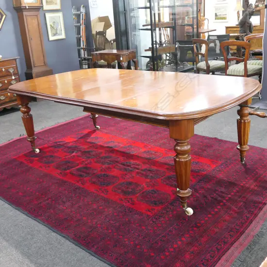 A Victorian mahogany crank extension dining table,