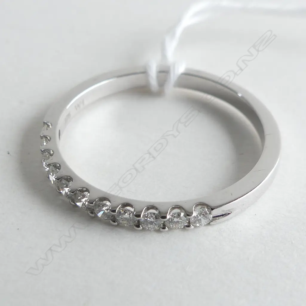 9CT WHITE GOLD 33CT CLAW SET BAND 2.4GMS (WITH VALUATION) Image 1++