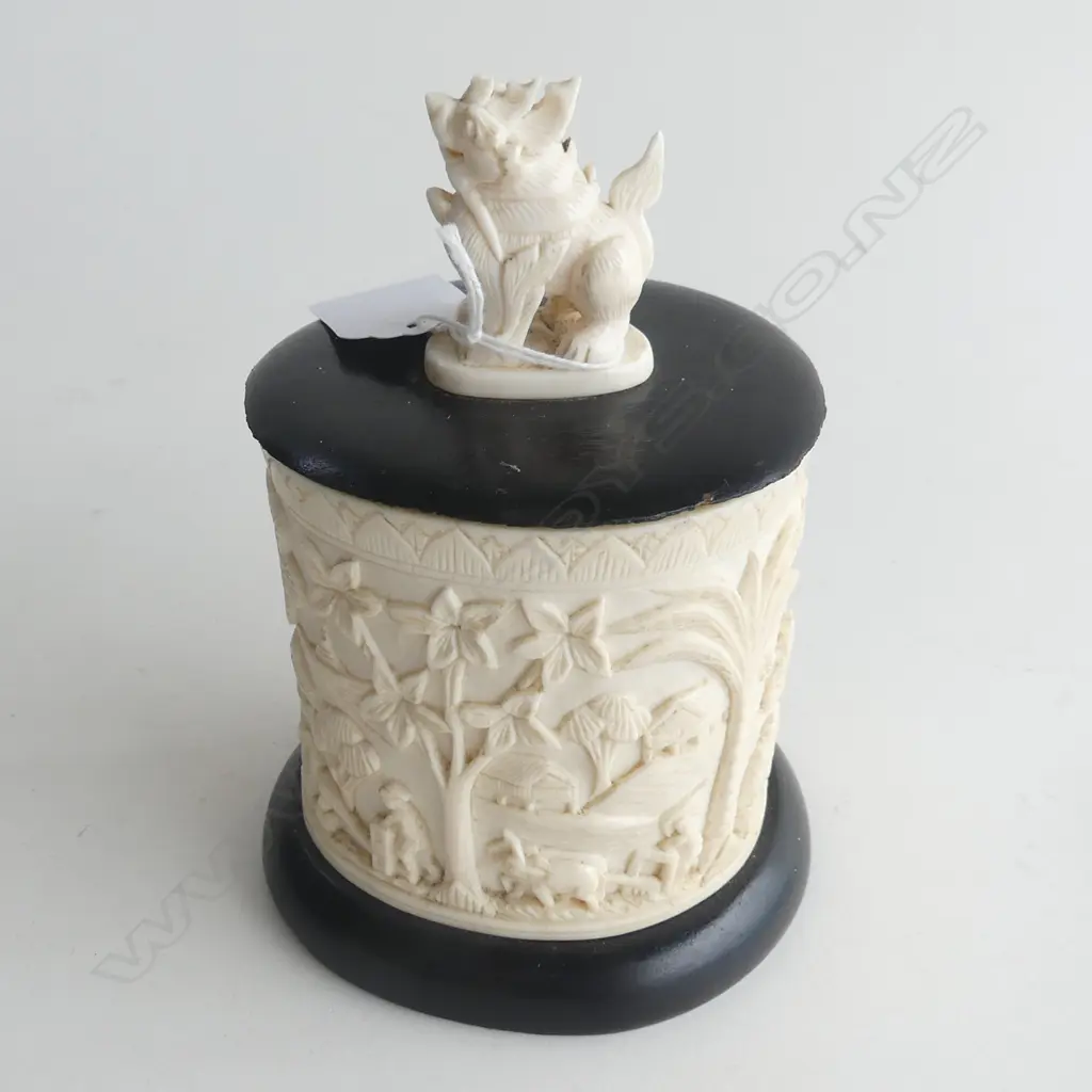 VILLAGE SCENE CARVED IVORY BOX WITH MOUNTED FOO DOG ON LID H. 150MM (CRACK TO SIDE OF BOX) Image 1++