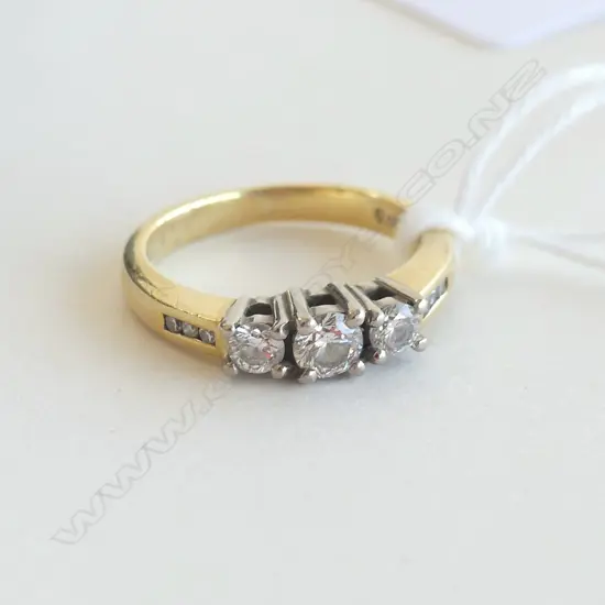 18CT 3 STONE DIAMOND RING with purchase receipt $3999