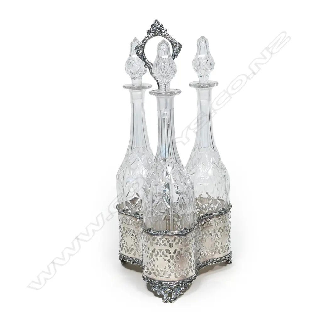 A Victorian silver plate triple decanter tantalus stand, Image 1++