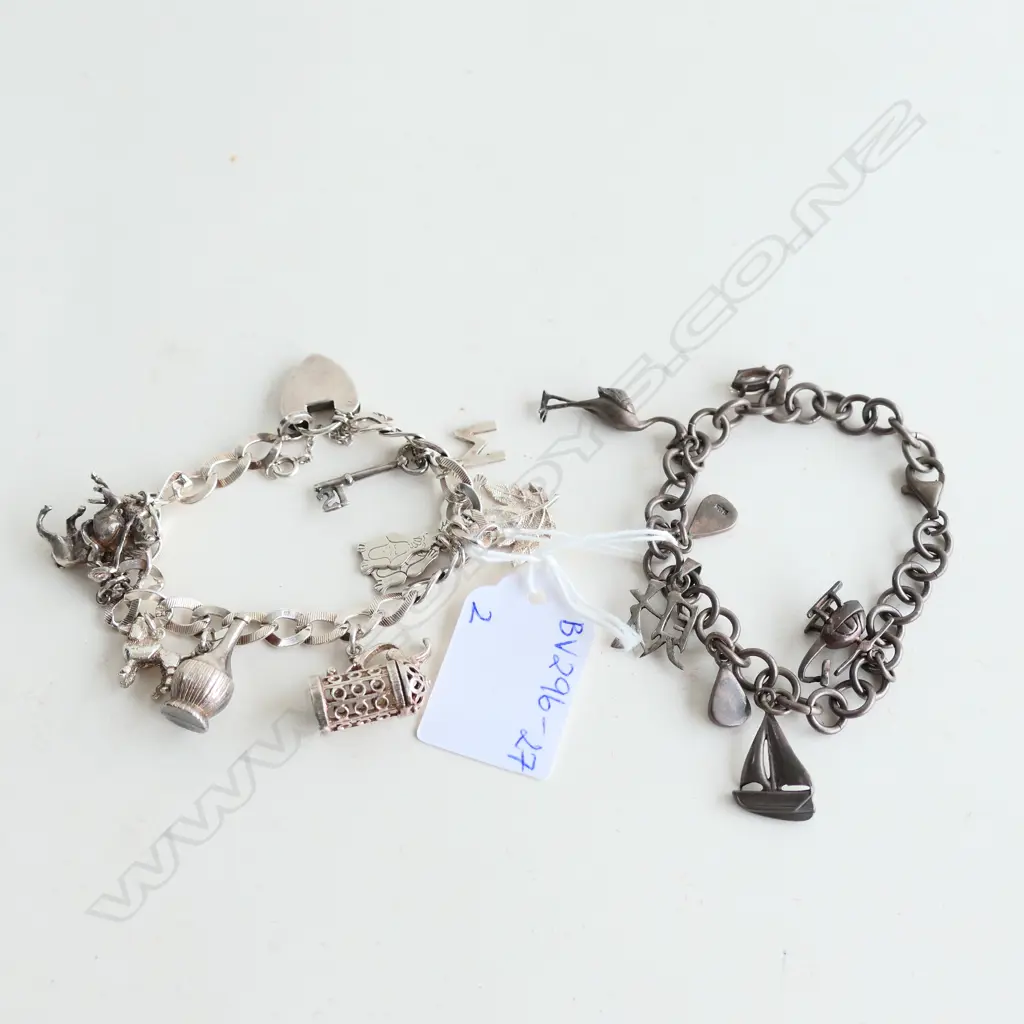 2 STG SILVER CHARM BRACELETS WITH CHARMS 58.62GMS Image 1++