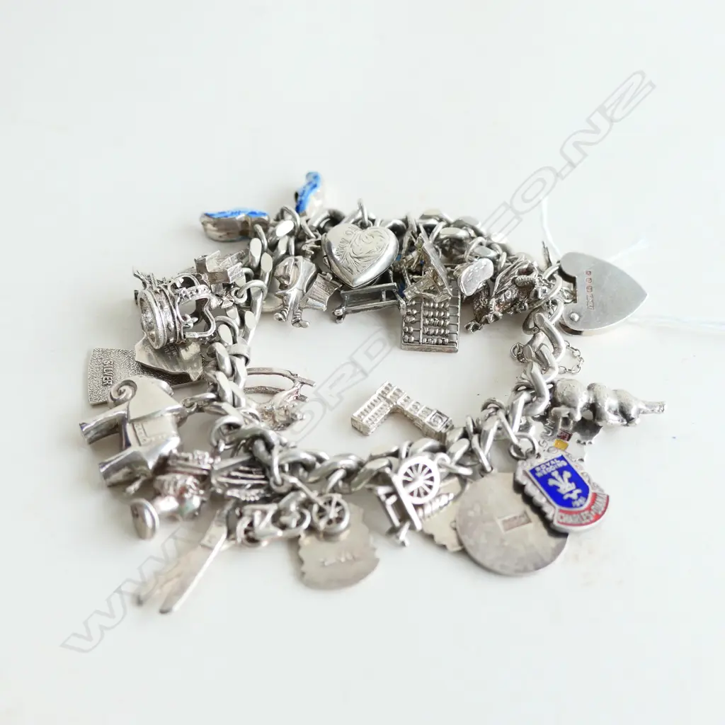 STG SILVER CHARM BRACELET WITH PADLOCK & APPROX 29 CHARMS 72.84GMS Image 1++