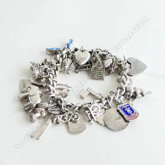 STG SILVER CHARM BRACELET WITH PADLOCK & APPROX 29 CHARMS 72.84GMS