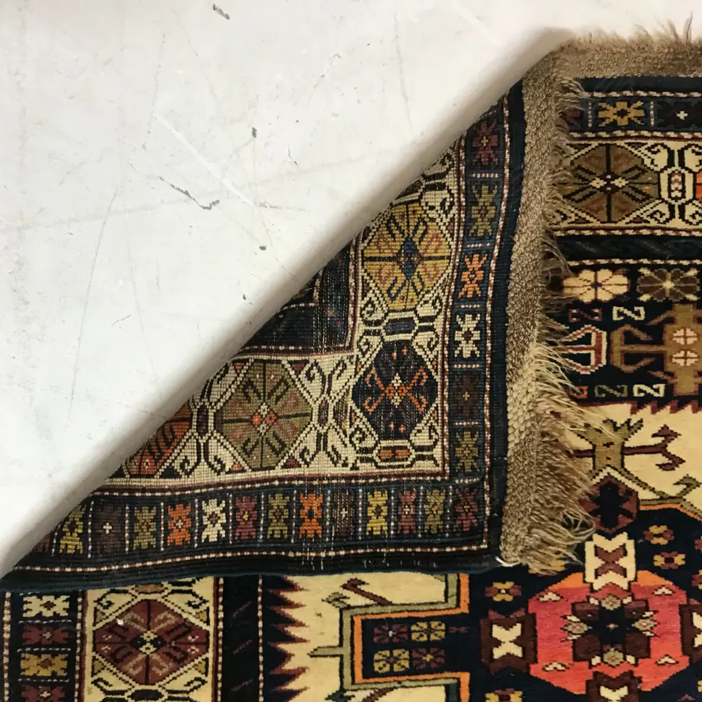 An outstanding Alikhanly, Kuba runner. [Possibly dated 1323 =1905 bottom left] 308 x 123cm Image 1++