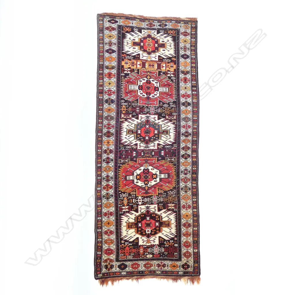 An outstanding Alikhanly, Kuba runner. [Possibly dated 1323 =1905 bottom left] 308 x 123cm Image 1++