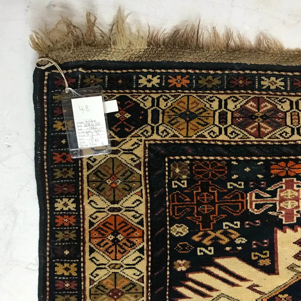 An outstanding Alikhanly, Kuba runner. [Possibly dated 1323 =1905 bottom left] 308 x 123cm Image 1++