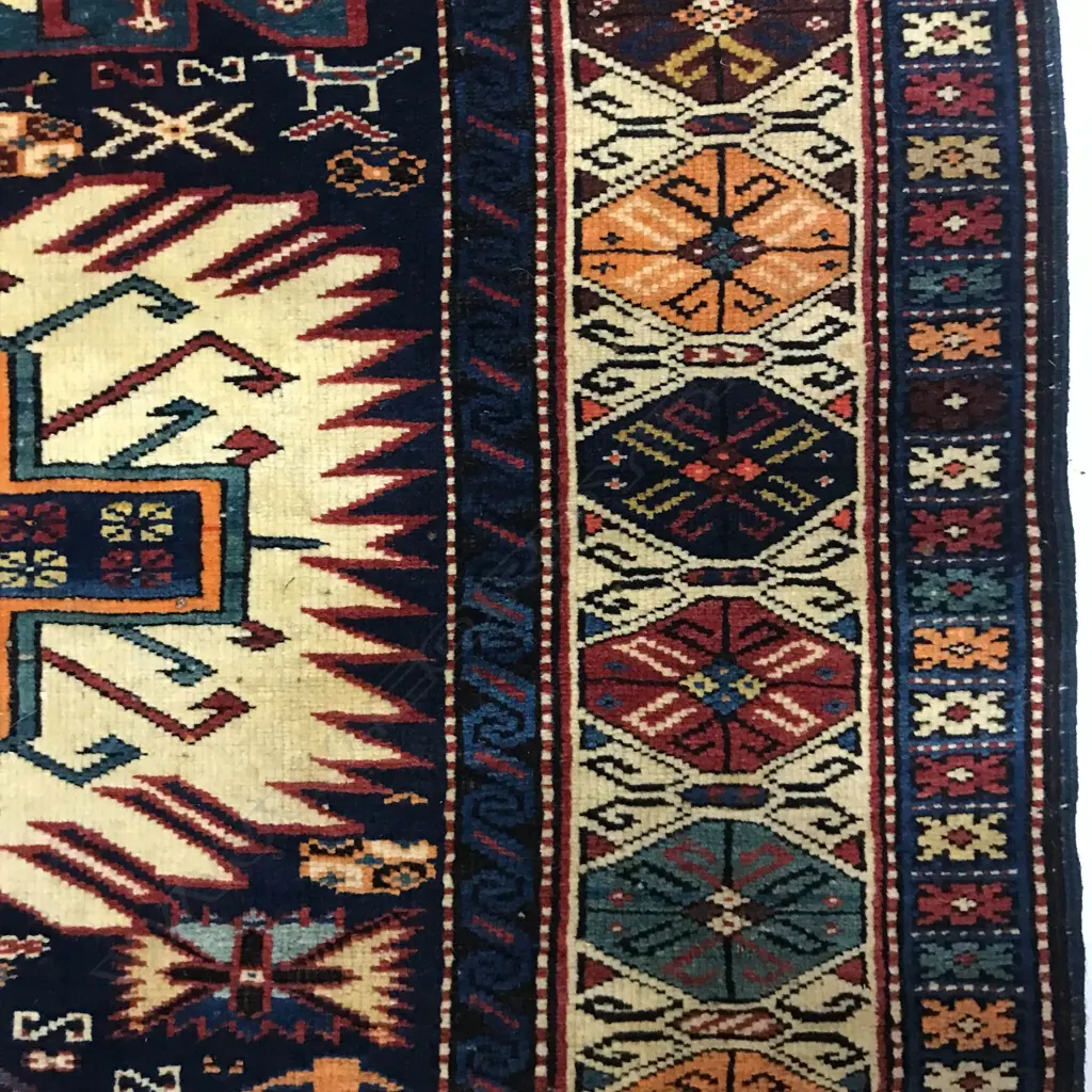 An outstanding Alikhanly, Kuba runner. [Possibly dated 1323 =1905 bottom left] 308 x 123cm Image 1++