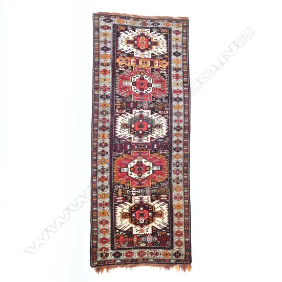 An outstanding Alikhanly, Kuba runner. [Possibly dated 1323 =1905 bottom left] 308 x 123cm