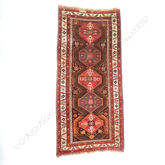 A Jebrail, Karabakh runner. Dated 1906 and named. 290 x 128cm.