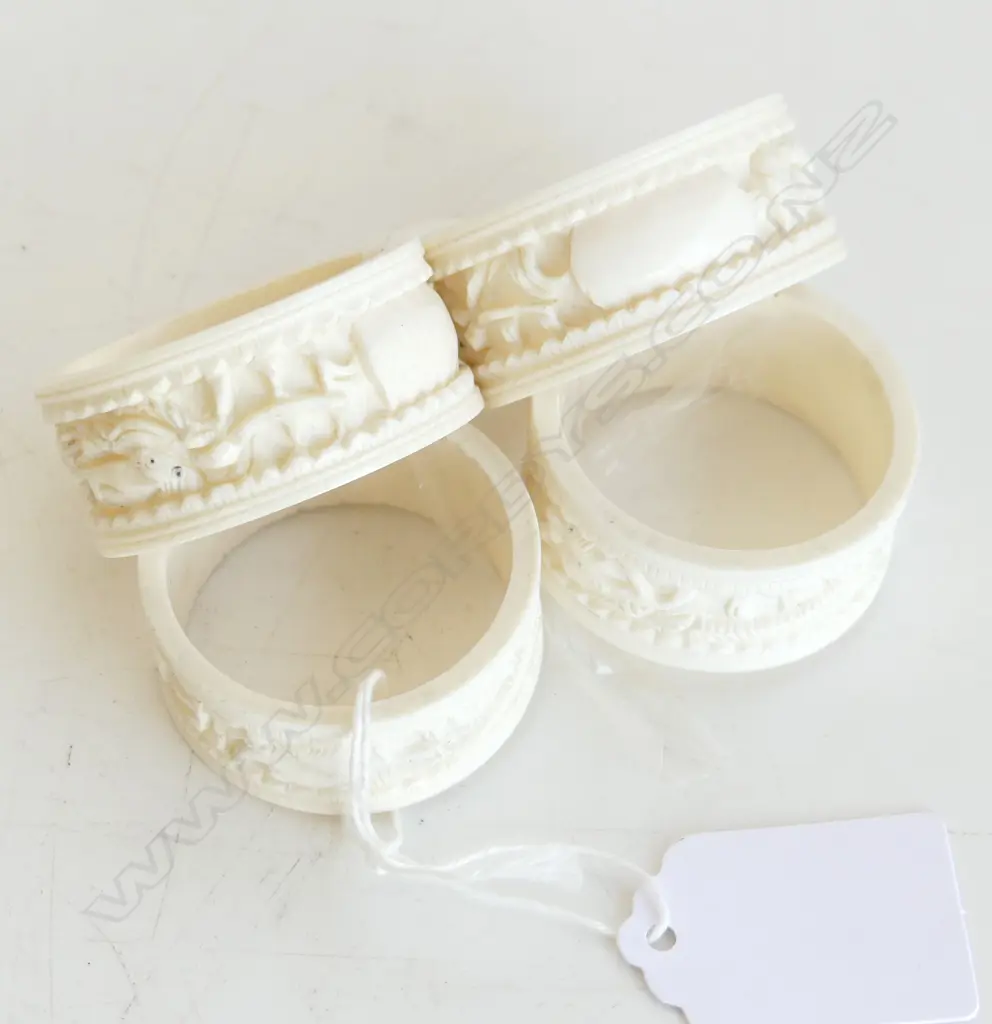 FOUR IVORY CARVED NAPKIN RINGS Image 1++