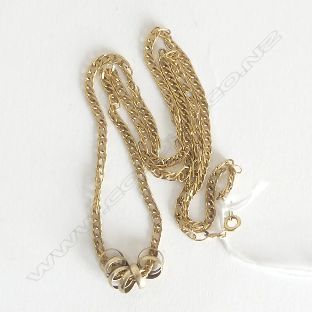 9ct GOLD NECK CHAIN WITH 7 SMALL RINGS L.529mm. ...gms Image 1++