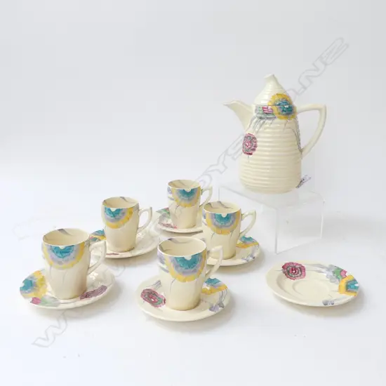 12 PCE CLARICE CLIFF BIZARRE HAND PAINTED DEMITASSE SET; 5 CUPS, 6 SAUCERS, COFFEE POT H.180mm...