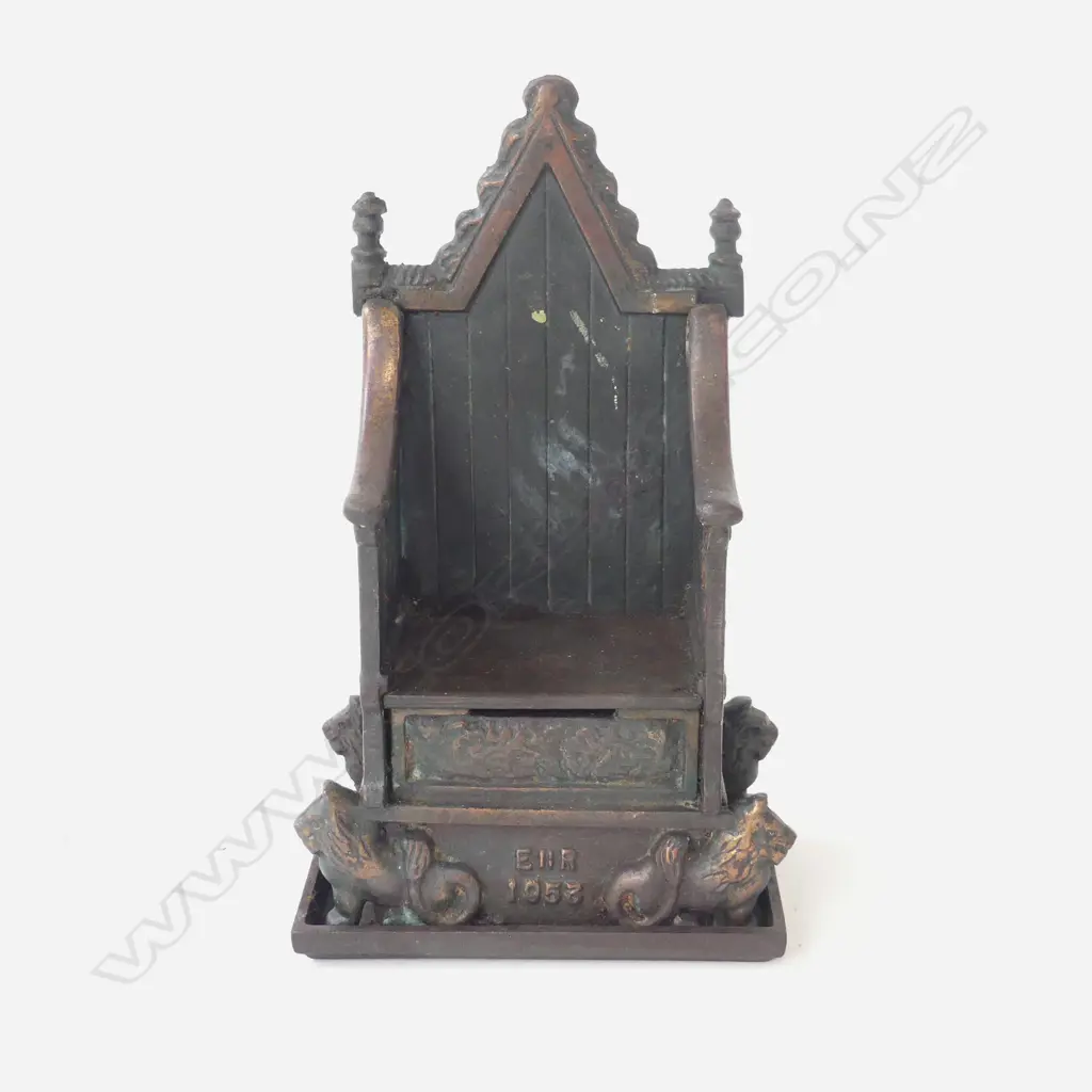 CAST IRON MONEYBANK WITH 'BRONZED' FINISH AS A THRONE, 1953 MAKER 'HARPER' 120X65X200mm. Image 1++