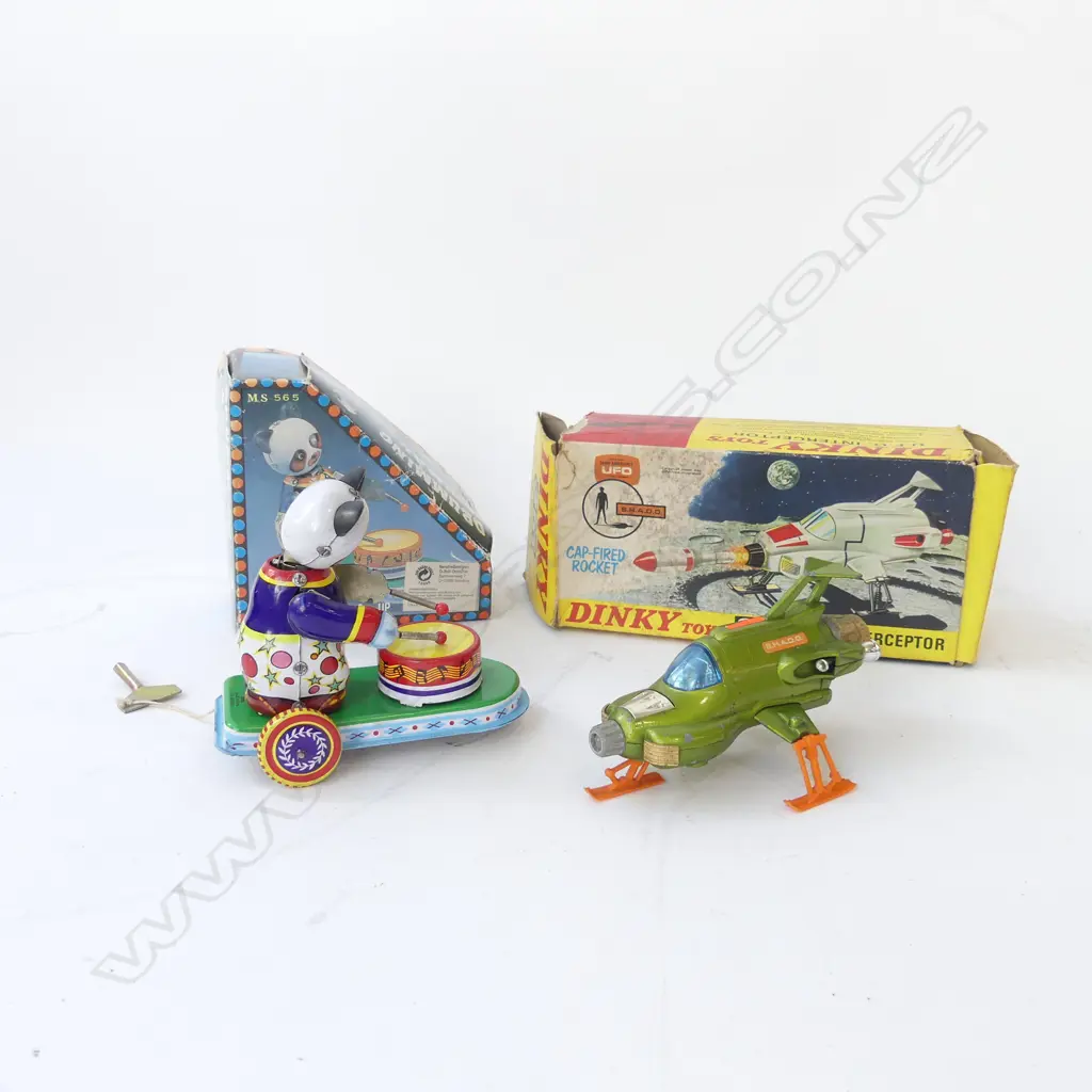 TWO BOXED TOYS. DINKY INTERCEPTOR L. 140mm & CHINESE TIN 'DRUMMING ANIMAL' 120X100mm Image 1++