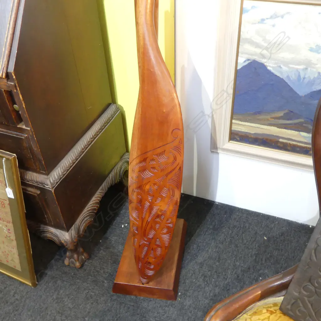 **RTV** WAKA HOE; MAORI CARVED WOODEN ORNAMENTAL CANOE PADDLE L.1520mm ON STAND H.870mm Image 1++