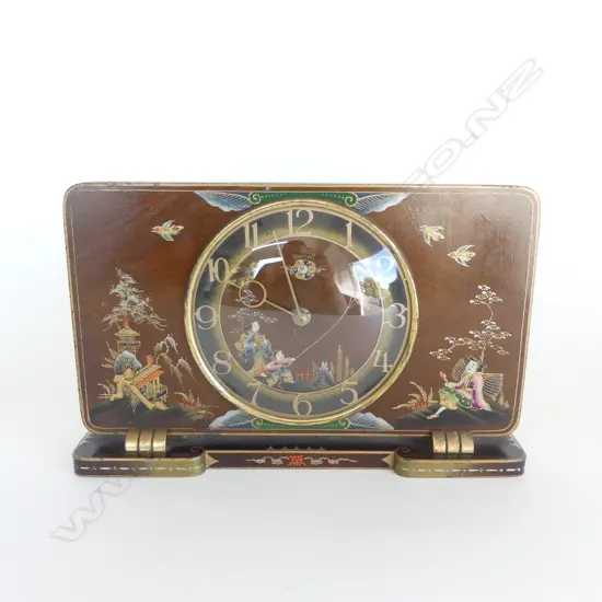UNUSUAL MID CENTURY JAPANESE CLOCK IN THE MANNER OF C1900 ENAMEL WORK WITH IMAGES OF KITE FLYING ETC, WORKING. 270X60X18
