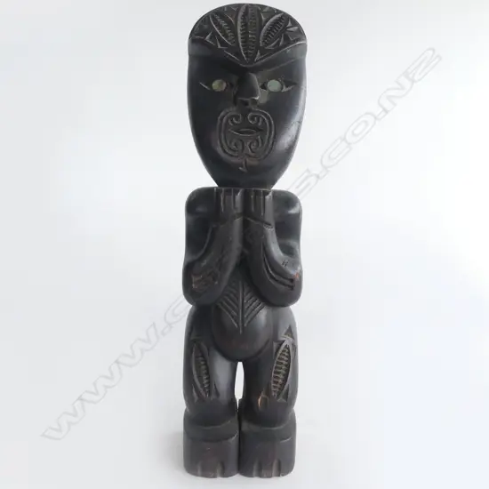 MAORI CARVED & EBONISED TEKOTEKO paua shell eyes mid/late 20thC. H.290mm.