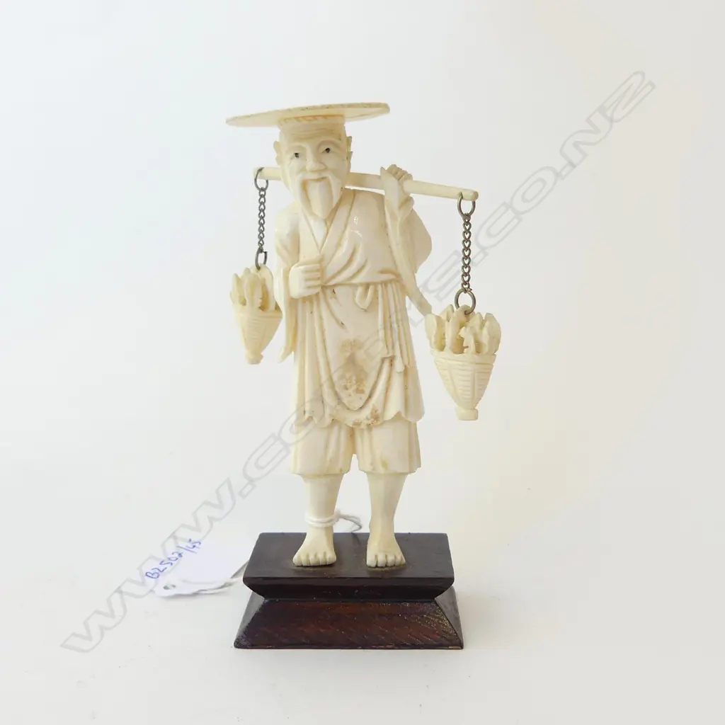 IVORY CARVED FISHERMAN CARRYING BASKETS OF FISH ON WOODEN MOUNT (REPAIR TO HAT) H.120MM Image 1++