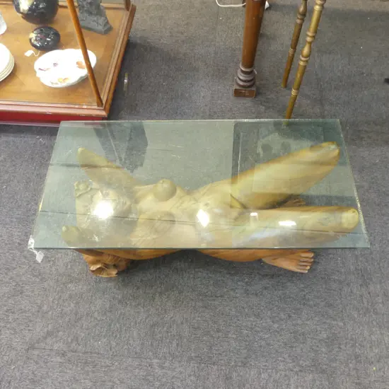 COFFEE TABLE; CARVED WOODEN NUDE BASE, GLASS TOP 450x900x340mm