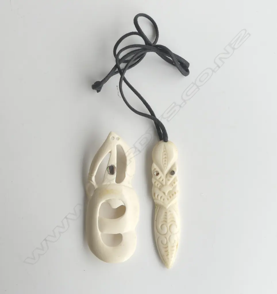 2 CONTEMPORARY MAORI CARVED BONE PENDANTS. Mask w tongue extended + manaia type L's.90mm. Image 1++
