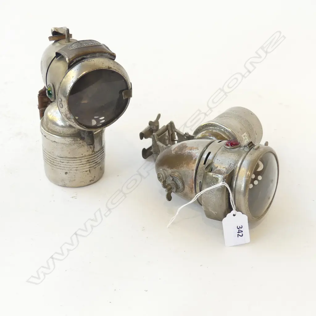TWO ANTIQUE CARBIDE CYCLE LAMPS ‘OBERMETALL’ AND ‘RIEMANN’, H.170MM Image 1++