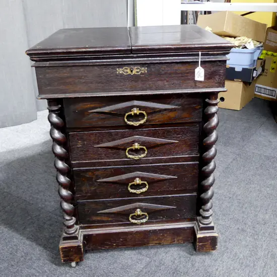 RARE EDWARDIAN OAK ARTIST''S SUPPLIES CABINET BY C. ROBERSON & CO. LONDON barley twist supports. Flap opening lids 535 x 490 x 730mm