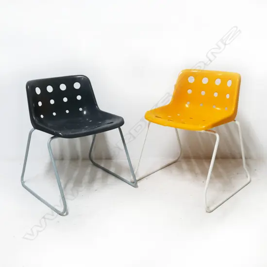 2 ROBIN DAY FOR HILLE PLASTIC ARMCHAIRS; CRACK TO YELLOW, FADING TO BLACK