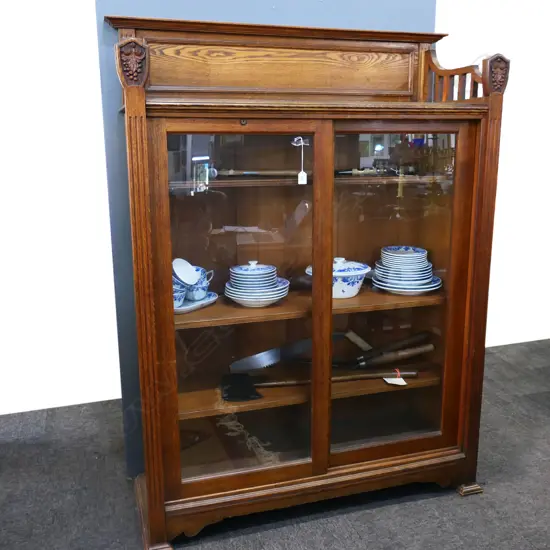 An early 20thC oak Arts and Crafts glazed bookcase,