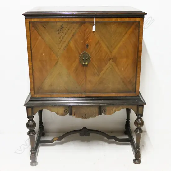 WALNUT VENEER CABINET ON TURNED LEGS, DISCOLOURATION TO SHELVES, H1220MM W860MM